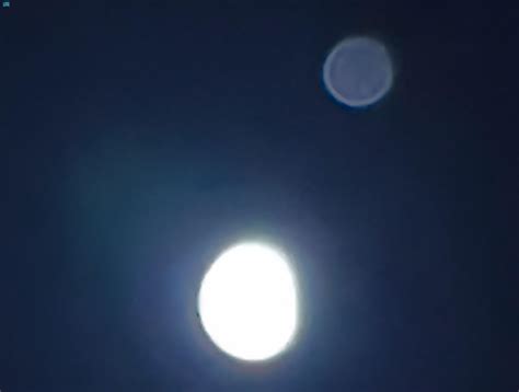 Observing The Rare Conjunction Of The Moon And Jupiter In The Sky Of