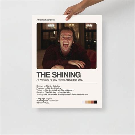 A Person Holding Up A Fake Poster With The Caption The Shining