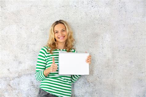 Premium Photo Portrait Of Smiling Mid Adult Woman Holding Blank Diary