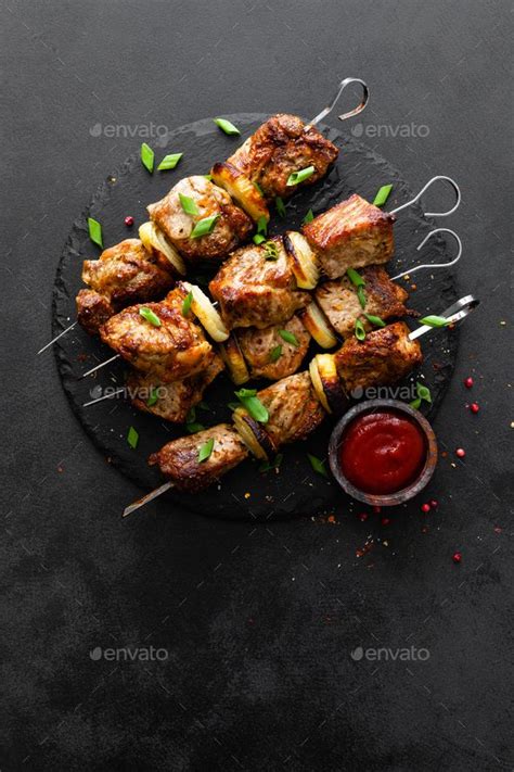 Grilled Meat Skewers Shish Kebab On Black Background Top View