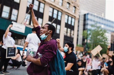 Man With Raised Fist in a Protest · Free Stock Photo