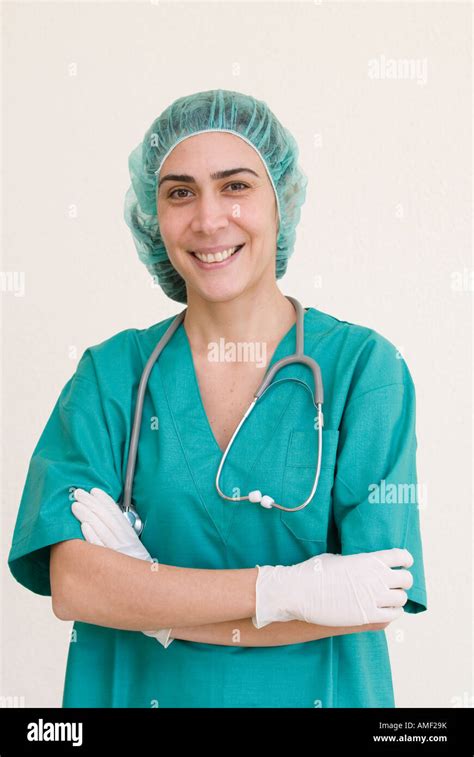 smiling mature female surgeon doctor in scrubs Stock Photo - Alamy