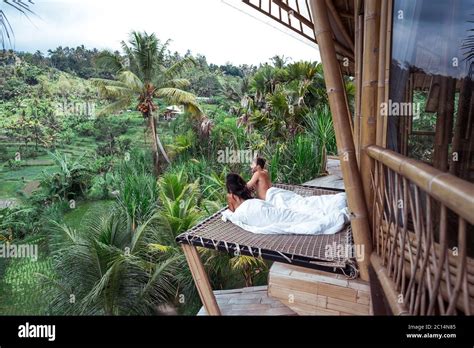 Couple Enjoying Morning Vacations On Tropical Jungle Villa Bungalow Looking Palms Relaxing