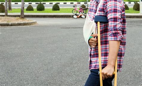 Injury Woman with Broken Arm Wearing an Arm Sling and Green Cast Stock ...