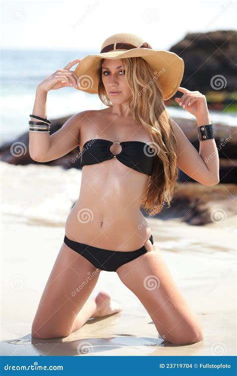 Kneeling Bikini Model In Straw Hat At Beach Stock Photo Image Of