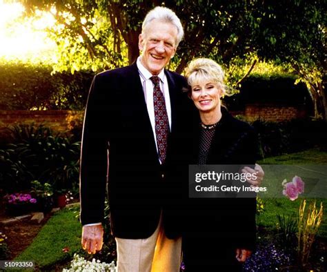 James Jim Arness And Wife Janet Pose For A Photograph In Their