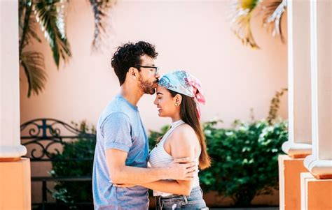 Premium Photo Man Kissing His Girlfriend Forehead Outside Cute Couple