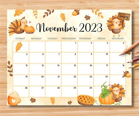 a calendar with autumn decorations and pencils next to it on a wooden table top