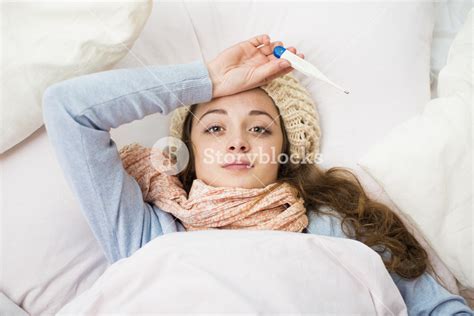 Sick Woman With Thermometer Is Lying In Bed She Has Cold Flu And High