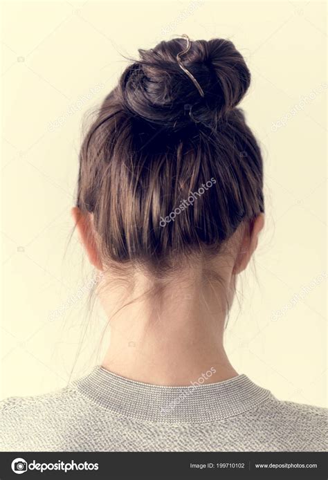 Woman Making Hair Bun — Stock Photo © Rawpixel #199710102