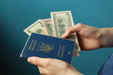 Premium Photo Ukrainian Passport And Dollars In Hands