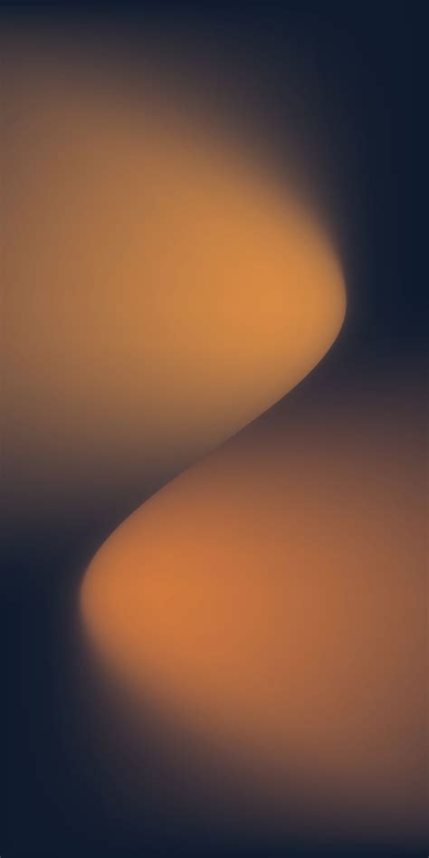 A Blurry Image Of An Orange And Black Background With The Light