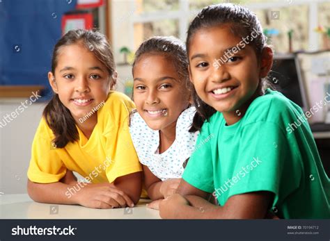 Three Young Primary School Girls Sitting In Class Stock Photo 70194712