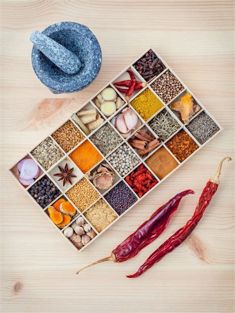 Assortment Of Spices Food Cooking Ingredients In Wooden Box And Stock