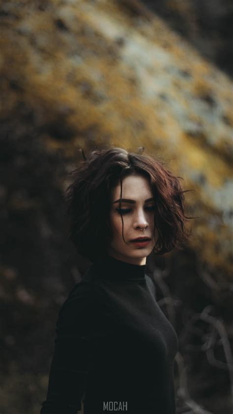 A Woman With A Nose Piercing Wearing Black With Red Lipstick In Laguna