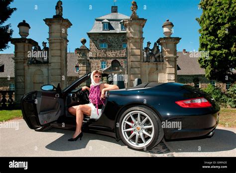 Woman sitting in porsche in hi-res stock photography and images - Alamy