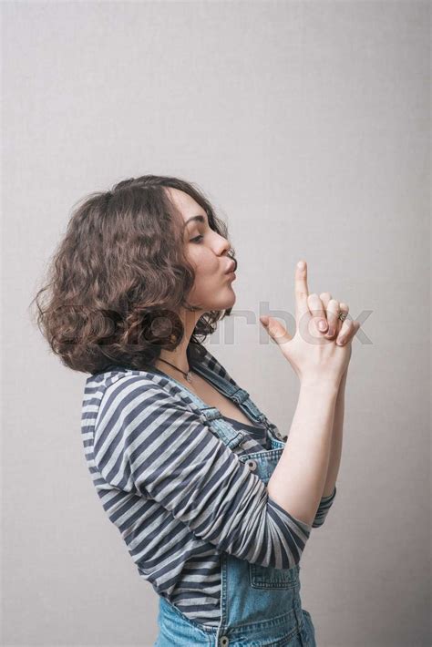 Beautiful Young Girl Hand Pretending To Pistol Shoot Stock Image