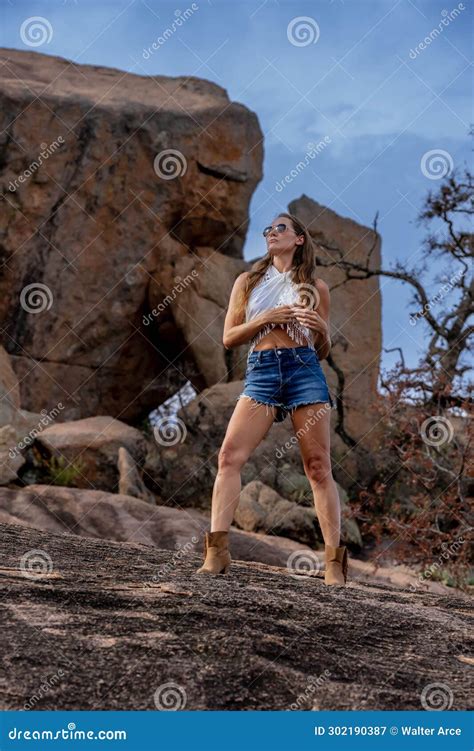 A Lovely Brunette Model Poses Outdoors While Enjoying The Fall Weather