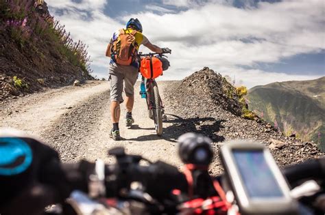 Biker Pushes His Bicycle Up In High Caucasus Mountains Stock Image