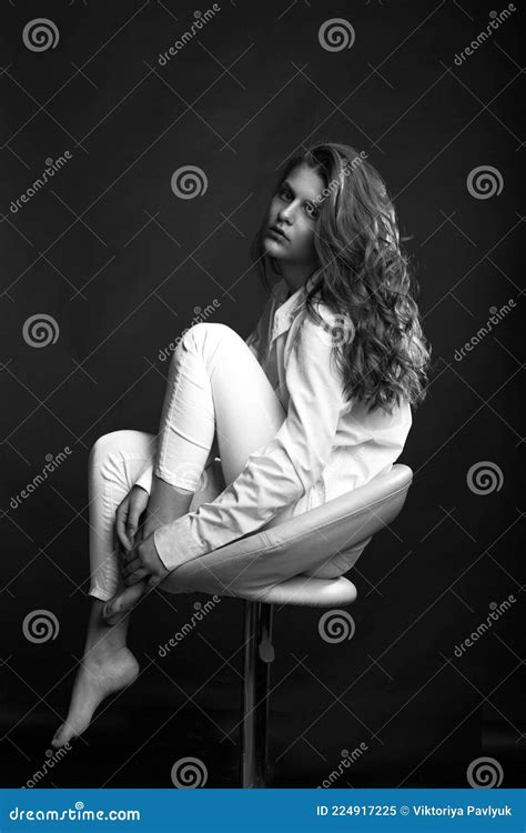 Attractive Model Sitting On A Chair At Dark Room Stock Image Image Of