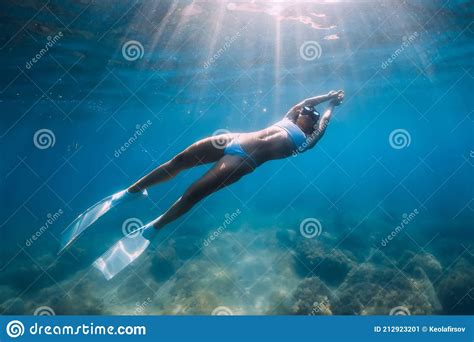 Freediver Glides Over Sandy Sea With White Fins Slim Woman Free Diver