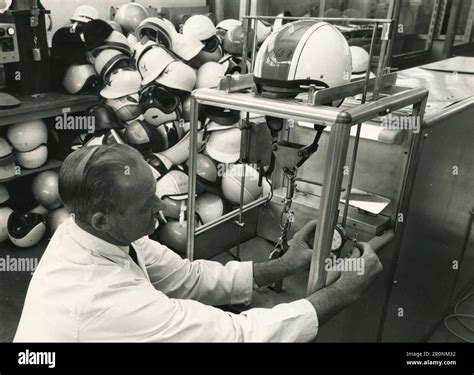 Man At Work On Breaking Tests On Crash Helmets At The British Standards