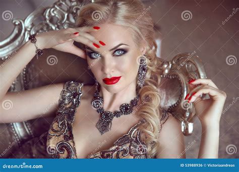 Fashion Indoor Portrait Of Beautiful Sensual Blond Woman With Ma Stock