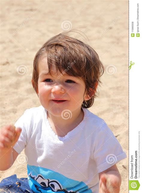 Portrait Of Old Cute Baby Enjoying His Time On The Beach Platja