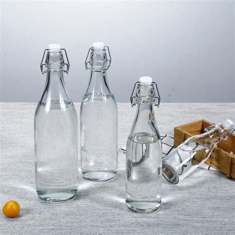 250 Ml 500 Ml 750 Ml 1000 Ml Round Shaped Clear Glass Drink Bottle With Swing Top Stopper For