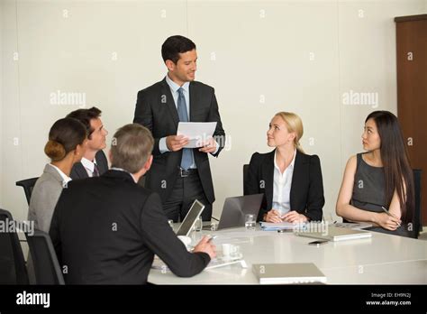 Executive giving presentation in meeting Stock Photo - Alamy