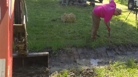 Mucking Out A Drainage Ditch With Mini Excavator And A Ditching Bucket