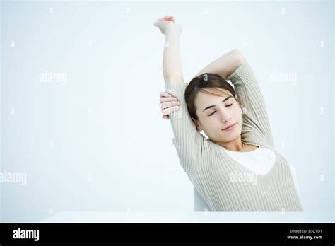 Woman Stretching Arms Eyes Closed Stock Photo Alamy