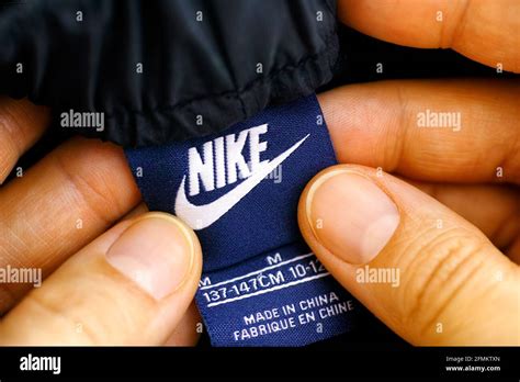 Tambov, Russian Federation - April 03, 2021 Woman hands with Nike Kids ...