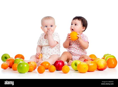 babies eating fruits Stock Photo - Alamy