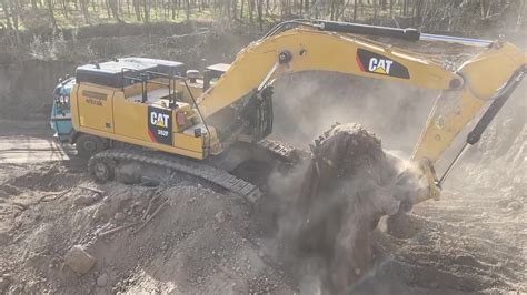 Caterpillar F Excavator Loading Mercedes And Man Trucks Ascon Ltd