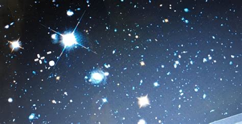 A cropped image from zoomed in Hubble legacy field . Anyone know what this bright star like ...