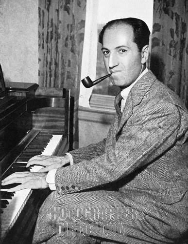 George Gershwin (1898-1937) at the piano. In 1925 he composed the ...