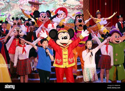 Walt Disney cartoon characters and Chinese students perform at the ...