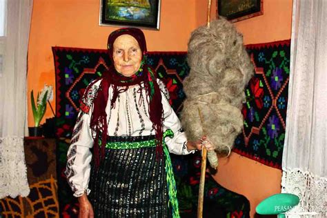 Romanian Peasant Hand Spinning Wool on a Distaff With Drop Spindle