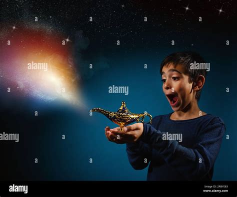 Amazed Child With Magic Aladin Lamp In Hand Stock Photo Alamy