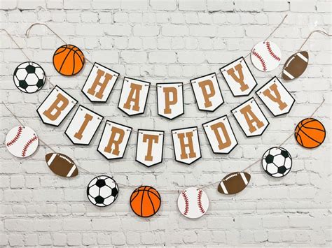 a happy birthday banner with sports balls on it