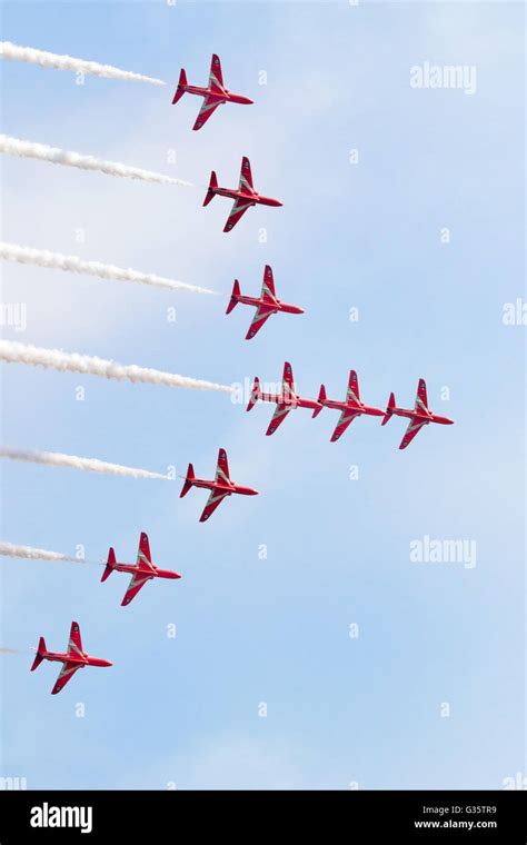 The Nine Members Of The Raf Red Arrows Aerobatics Team Performing At