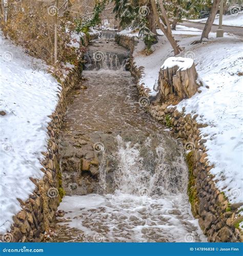 Clear Square Stone Lined Creek With Shallow And Clear Running Water In