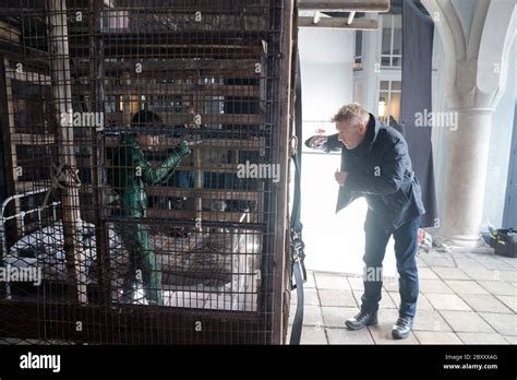 ARTEMIS FOWL, director Kenneth Branagh (right) on set, 2020. photo ...