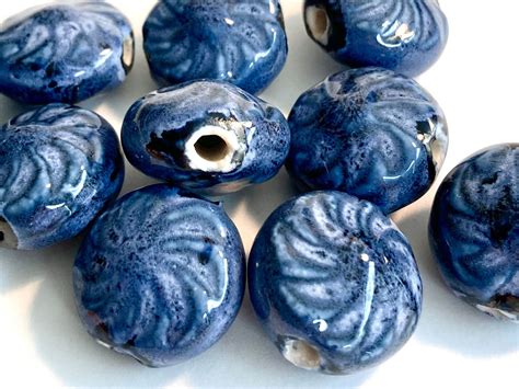 Antique Blue Glaze On White Ceramic Beads Embossed Swirls On Puffed Coin 4 Beads Approximately