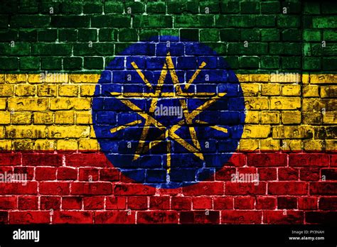 National flag of Ethiopia on a brick background. Concept image for ...