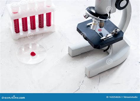 Blood Testing Laboratory Samples Viewing Under Microscope Near Tubes