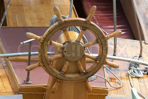 Old wooden steering wheel on the boat | Stock image | Colourbox