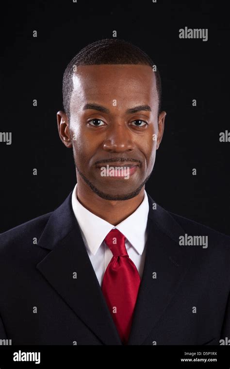 Black Man In Dark Suit White Shirt And Red Tie A Successful