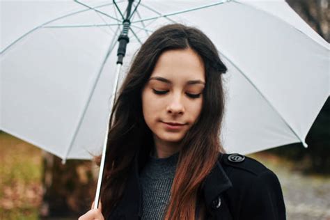 300 Wet Windy Winter Weather Blows Woman And Umbrella Away Stock